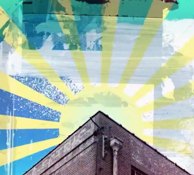 Oasis has received massive backlash online after the band shared a promotional video that prominently features imagery resembling the Rising Sun Flag