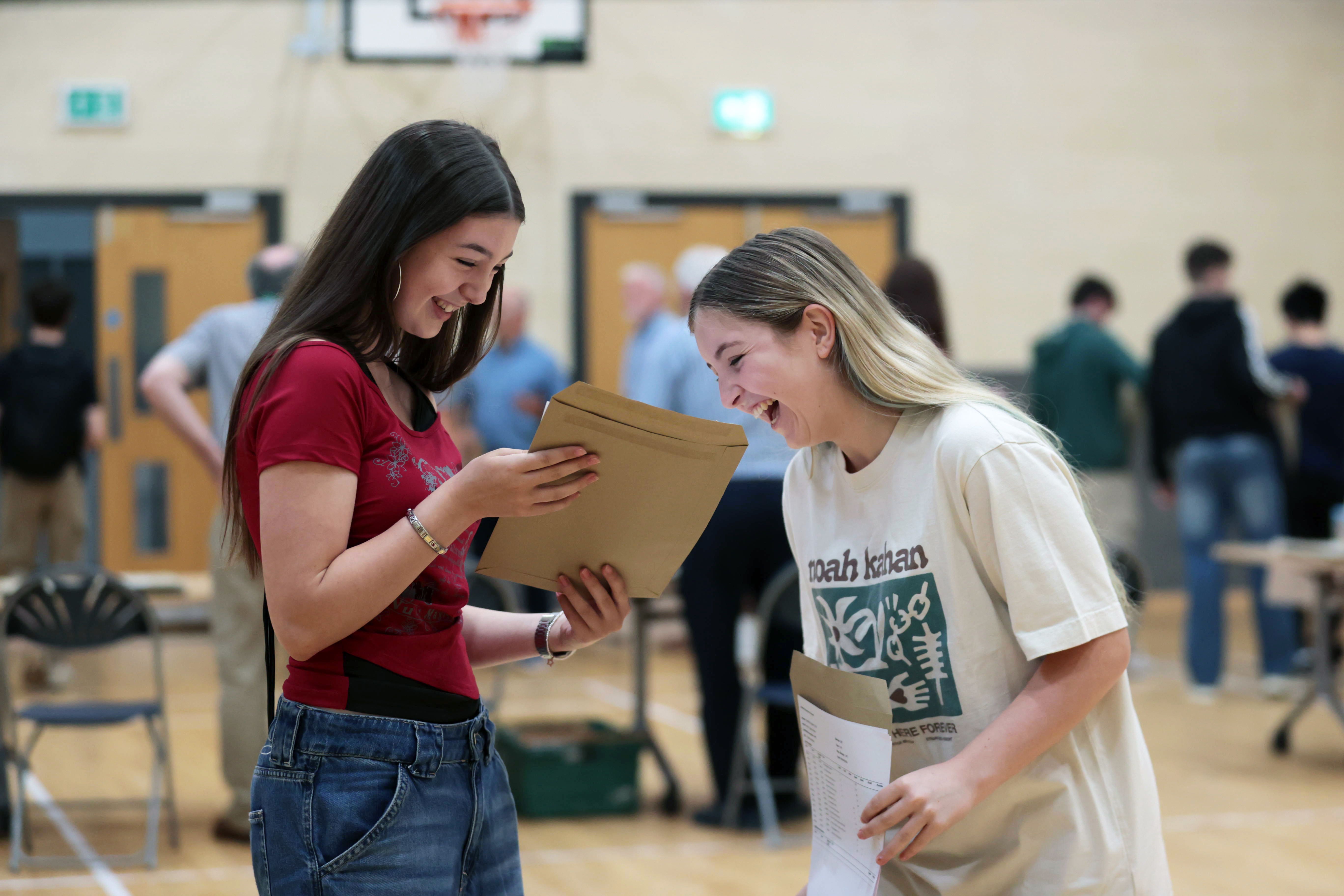 Isabelle Myles (left) and Hollie Wilson receive their A-level results at Sullivan Upper School in Holywood, Belfast (Liam McBurney/PA)