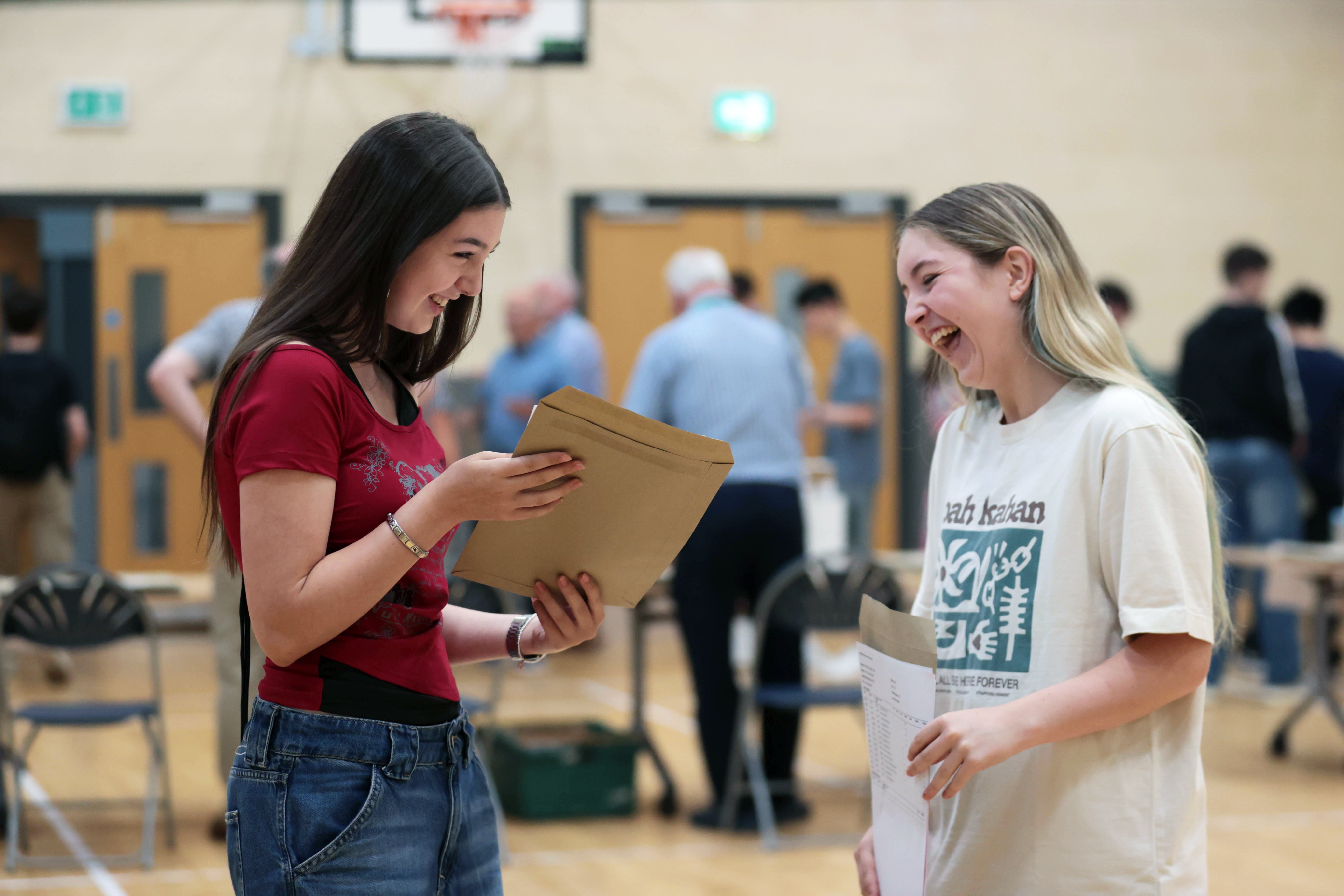 Isabelle Myles (left) and Hollie Wilson receive their A-level results at Sullivan Upper School in Holywood (Liam McBurney/PA)