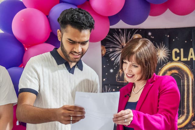 Education Secretary Bridget Phillipson joins student Ali Imran (left) as he receives his A-level results at Trafford College in Altrincham (Danny Lawson/PA)