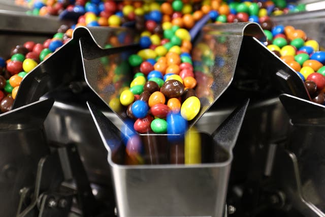 <p>M&M chocolate candies are seen in production. Mars Wrigley North America that it is transitioning away from artificial colors in the U.S.</p>
