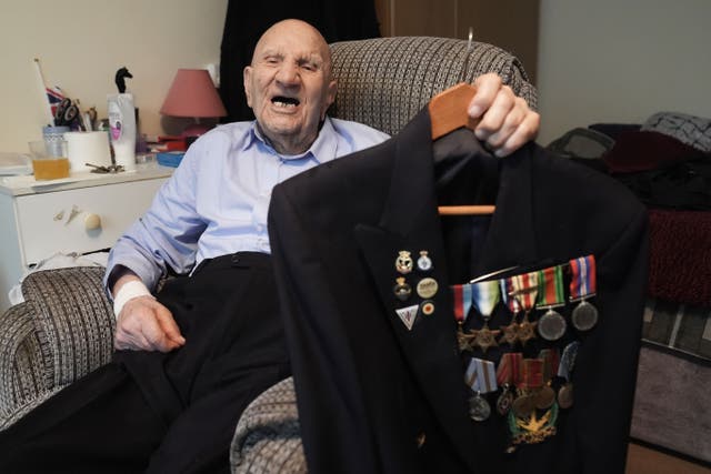 Second World War veteran Dougie Shelley, 99, shows off his medals (Stefan Rousseau/PA)