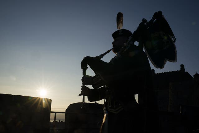 A lone piper has played on the battlements of Edinburgh Castle to mark the 80th anniversary of VJ Day (Jane Barlow/PA)