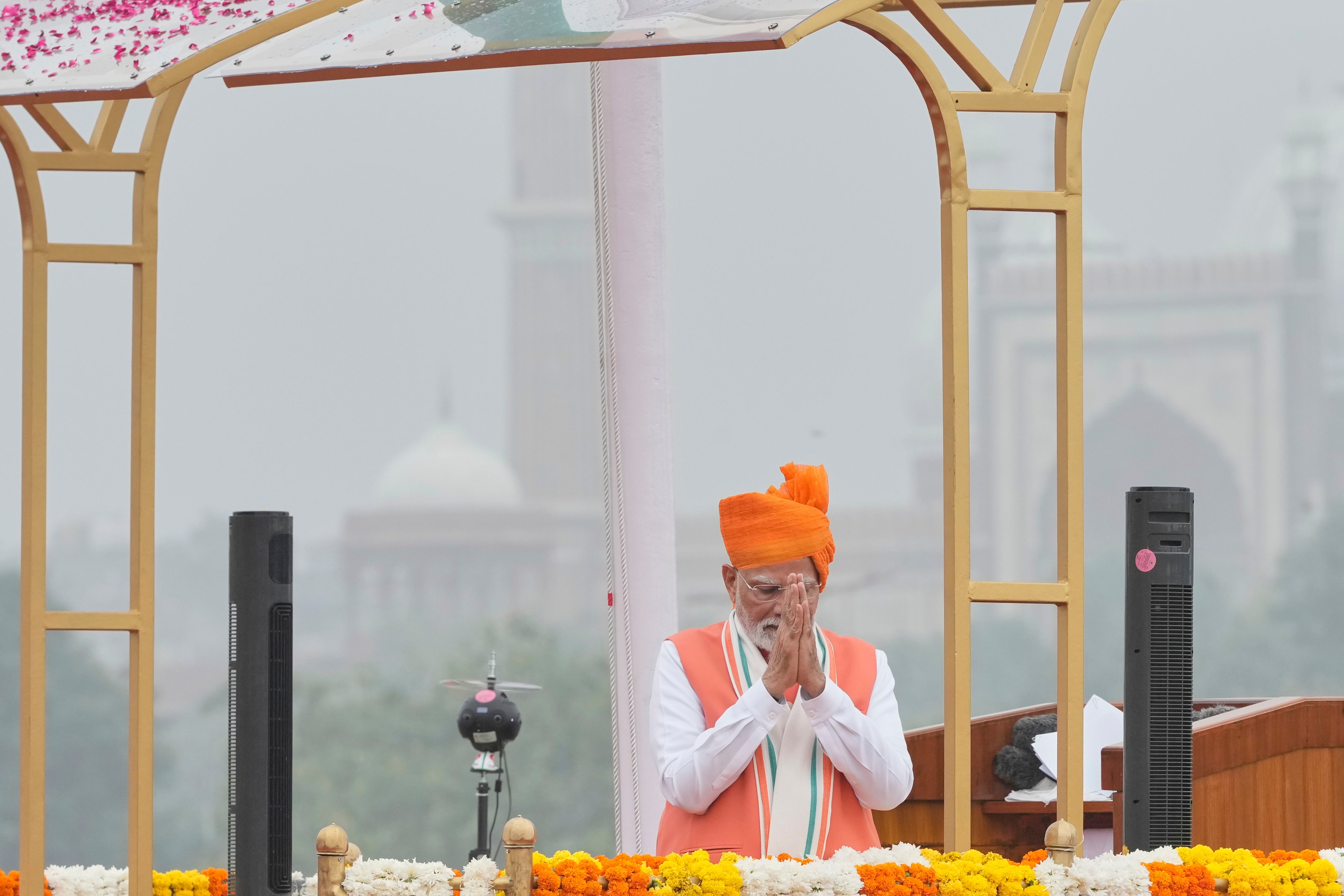 Indian Prime Minister Narendra Modi greets the invitees after addressing the nation from the rampart of the 17th-century Mughal-era Red Fort monument during the country's Independence Day celebrations in New Delhi