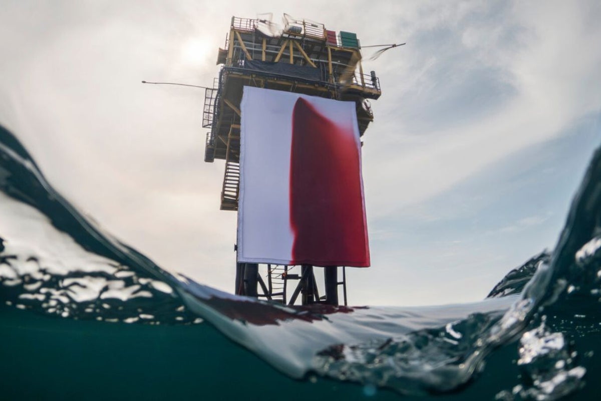 Climate activists spill 1,000 litres of fake blood over North Sea oil rig