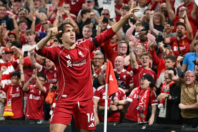 <p>Federico Chiesa celebrates with the Liverpool fans after scoring</p>