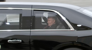 Trump and Putin riding in the back of ‘The Beast’
