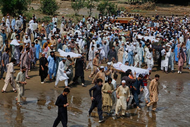 <p>People carry bodies of victims of Friday’s flash flooding, after funeral prayers at a village near Pir Baba, Buner district, in Pakistan’s northwest, Saturday, 16 August 2025. (AP Photo/Muhammad Sajjad)</p>