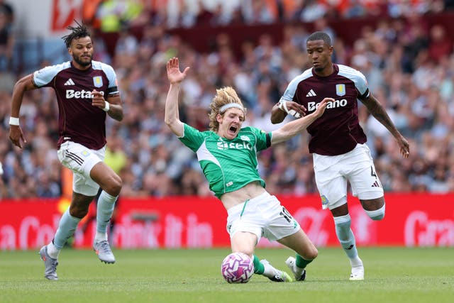 <p>Anthony Gordon is knocked down by Ezri Konsa</p>