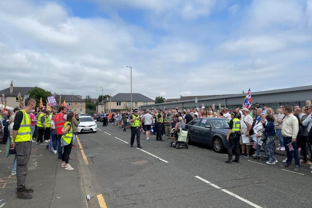 <p>Demonstrators on opposite sides of the road at the protest</p>