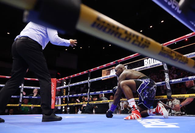 <p>Whyte struggling to get back to his feet</p>