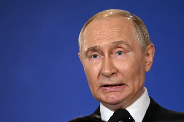 <p>Russian President Vladimir Putin speaks during a joint press conference with US President Donald Trump (out of frame) after participating in a US-Russia summit on Ukraine at Joint Base Elmendorf-Richardson</p>