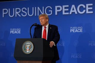 President Donald Trump listens during a news conference with Russian president Vladimir Putin at the Joint Base Elmendorf-Richardson in Alaska