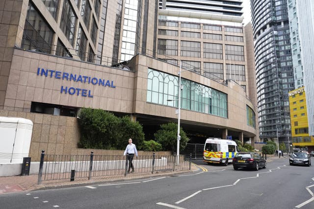 Police officers outside the Britannia International Hotel in Canary Wharf (Jordan Pettitt / PA)