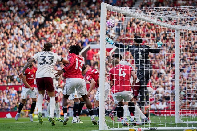 Manchester United goalkeeper Altay Bayindir, right, tried to reach the ball before Arsenal’s Riccardo Calafiori, left, scored (Dave Thompson/AP)
