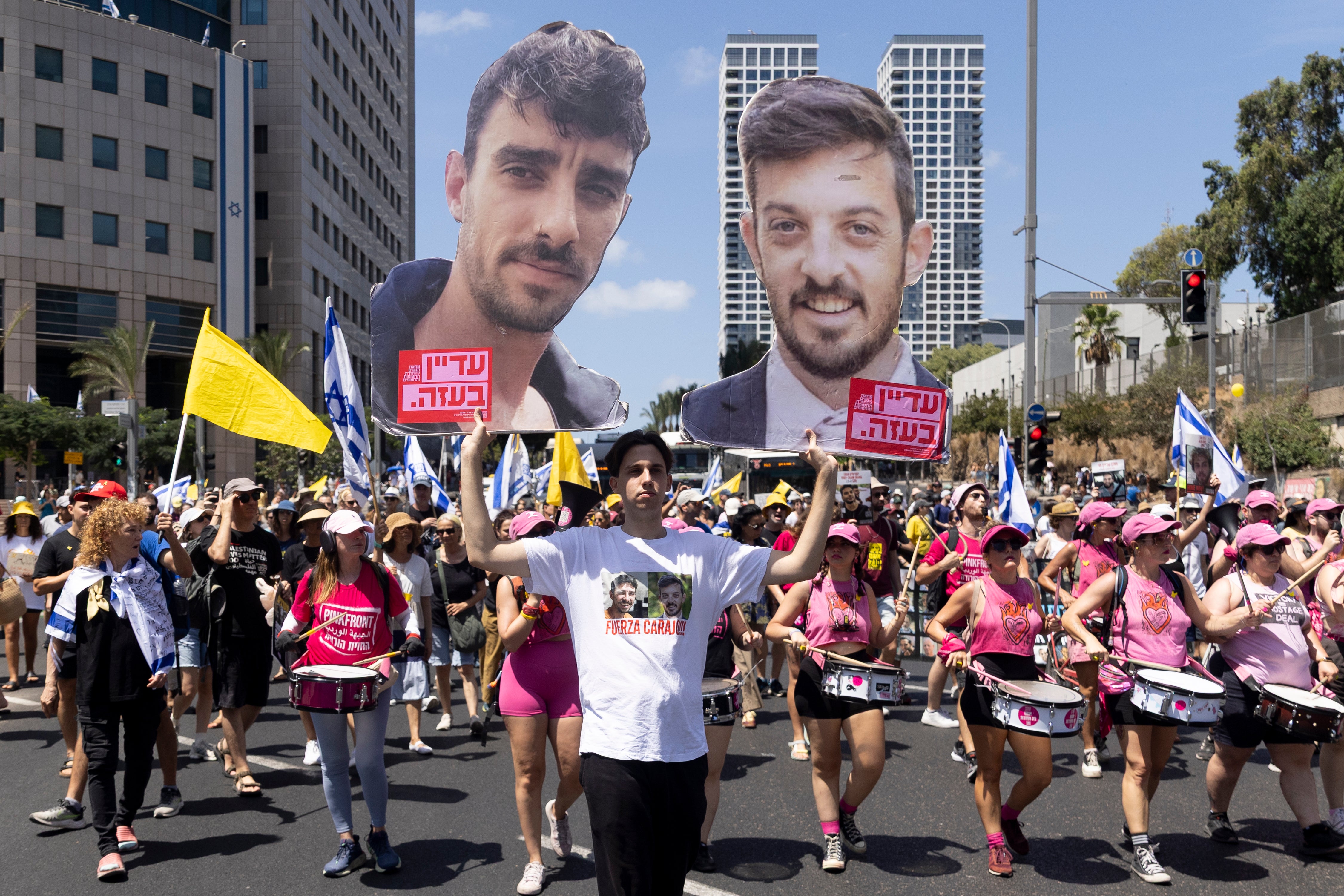 Protesters hold photos of hostages during the demonstration in Tel Aviv (Photo by Amir Levy/Getty Images)