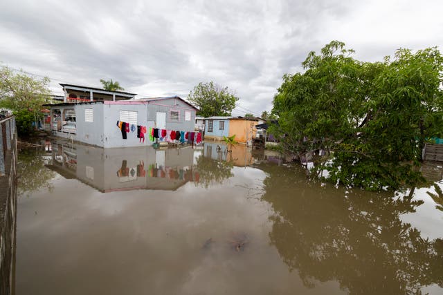 <p>Water surrounds a house in Guayama, Puerto Rico, as Hurricane Erin brings rains to the island, Sunday, Aug. 17, 2025</p>
