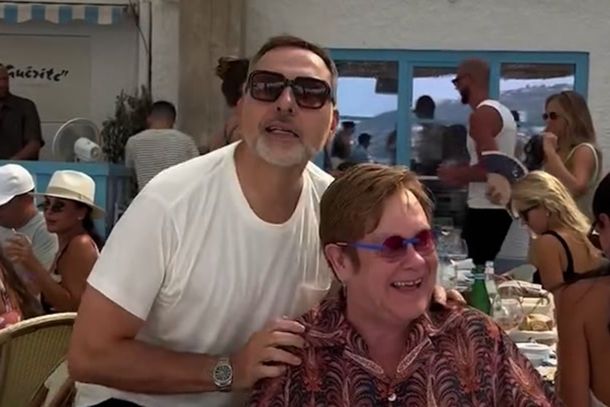 Elton John dances with David Walliams as he enjoys retirement in France