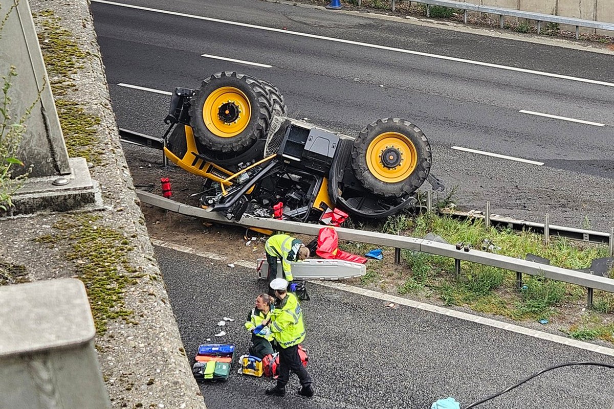Man in hospital after tractor falls from bridge onto motorway