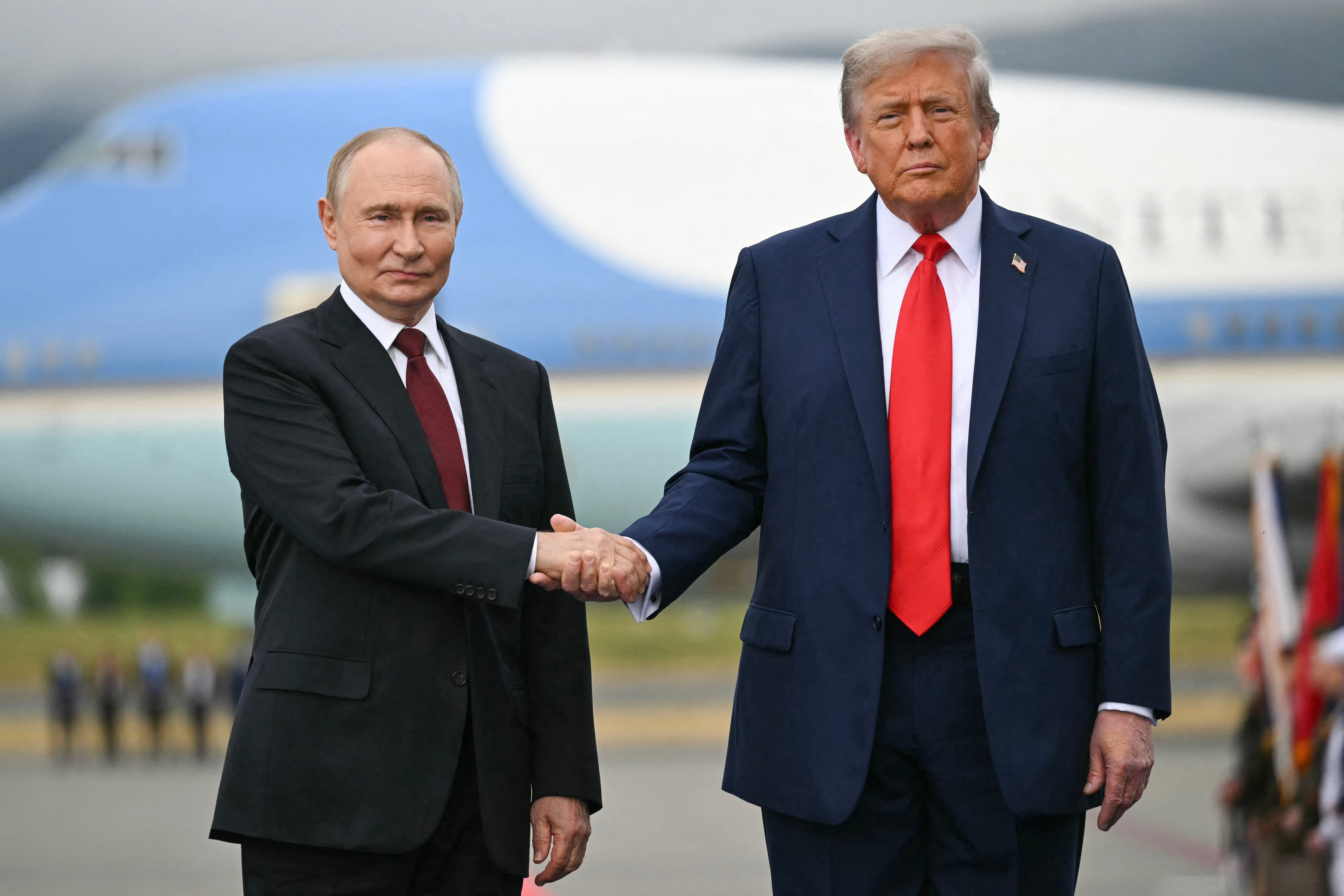 Donald Trump and Vladimir Putin shake hands in Anchorage, Alaska, on Friday August 15 2025