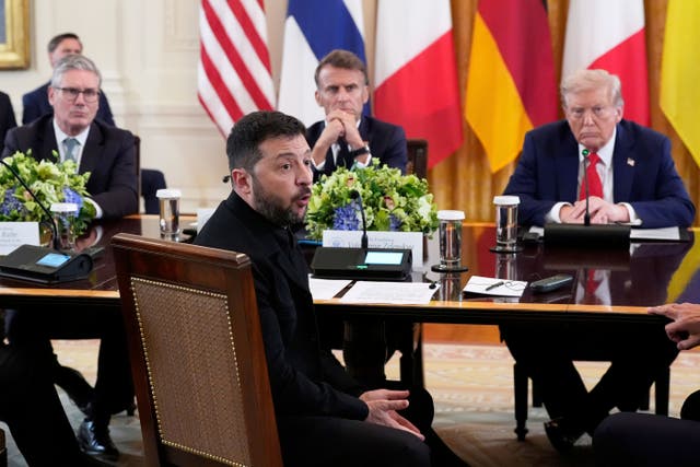 Ukrainian president Volodymyr Zelensky (front) at the negotiating table ahead of closed-door talks, watched on by UK Prime Minister Sir Keir Starmer, French president Emmanuel Macron and US president Donald Trump (Alex Brandon/AP)