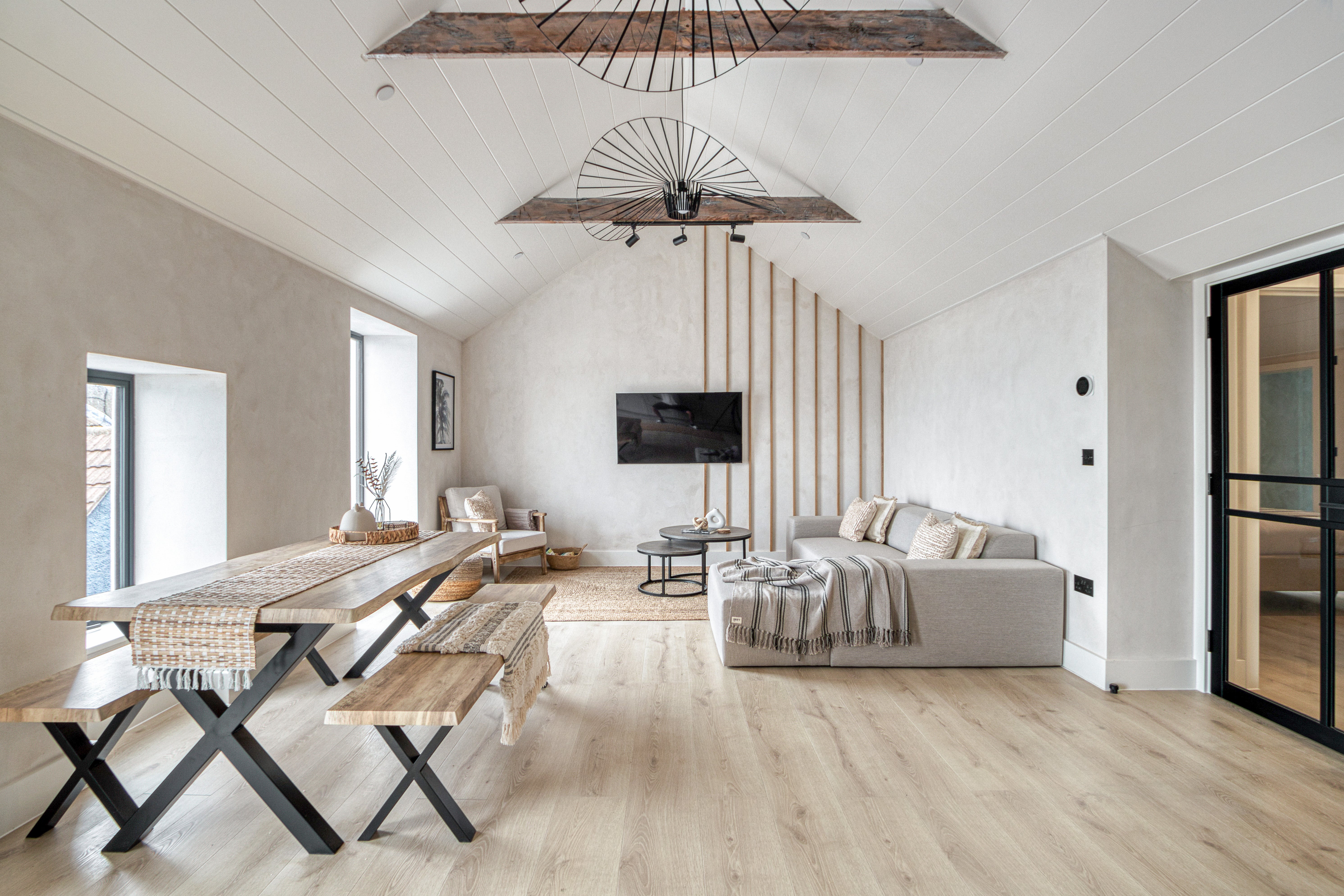 This sleek townhouse spread across three apartments comes with views over Mumbles Bay in Swansea