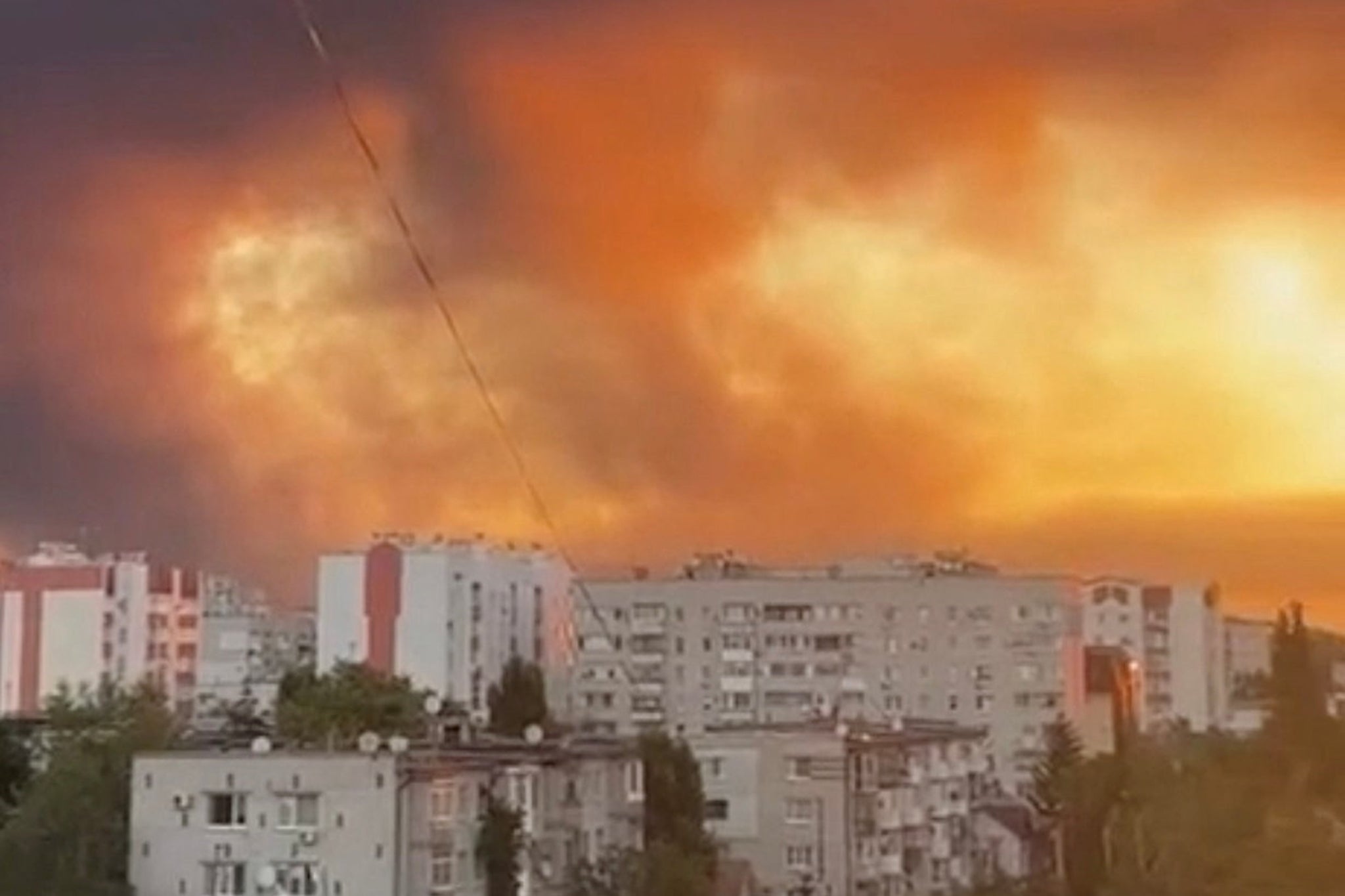 <p>Morning sunlight shines through rising smoke after overnight Russian drone and missile strikes on energy facilities in Kremenchuk, Poltava region, during Russia's war in Ukraine, August 19, 2025</p>