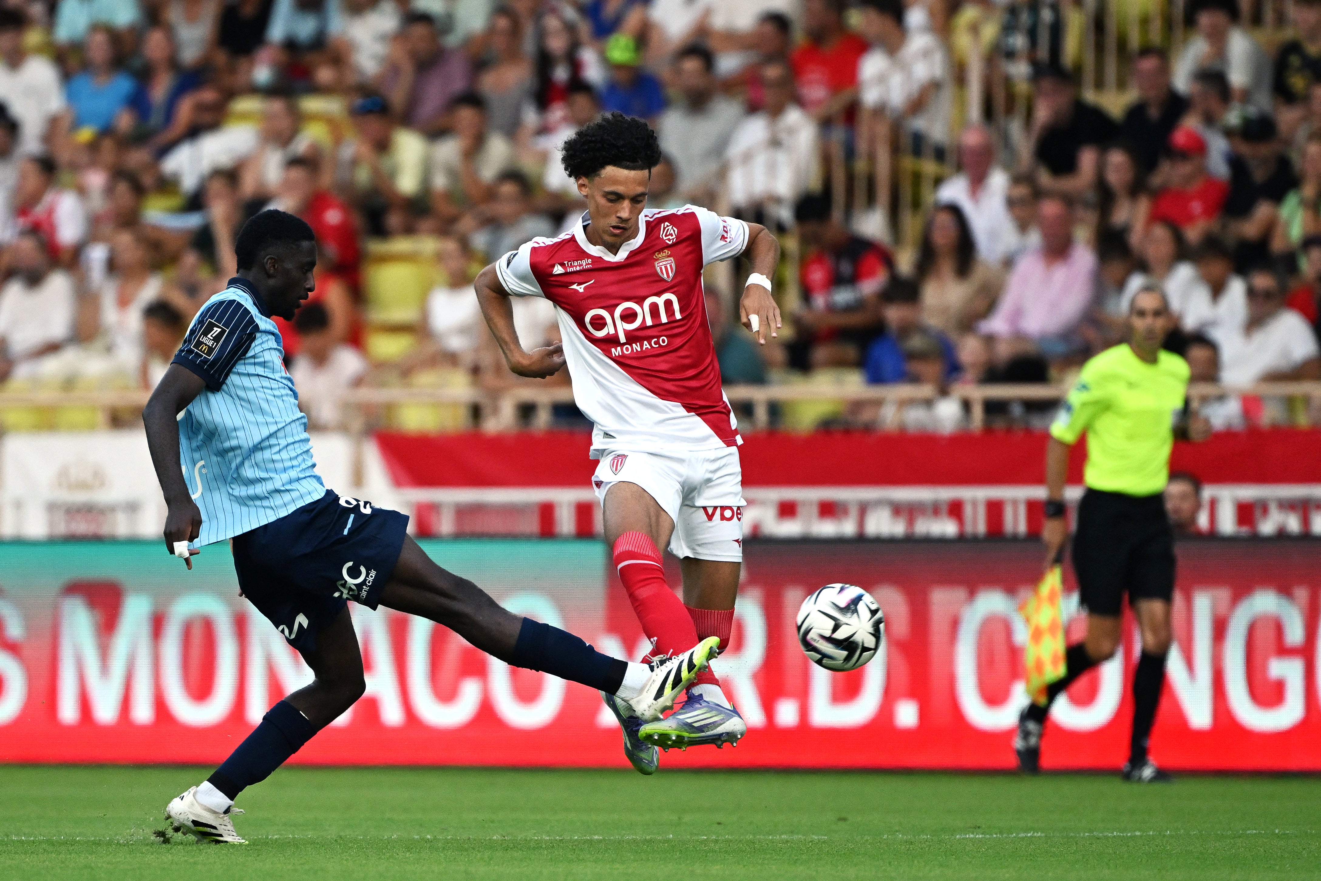 Maghnes Akliouche controls the ball for Monaco against Le Havre