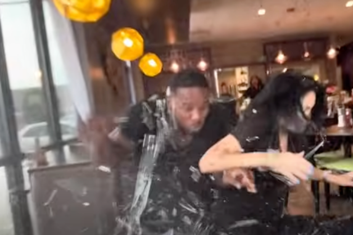 Couple escape death after car crashes into restaurant table during influencer filming