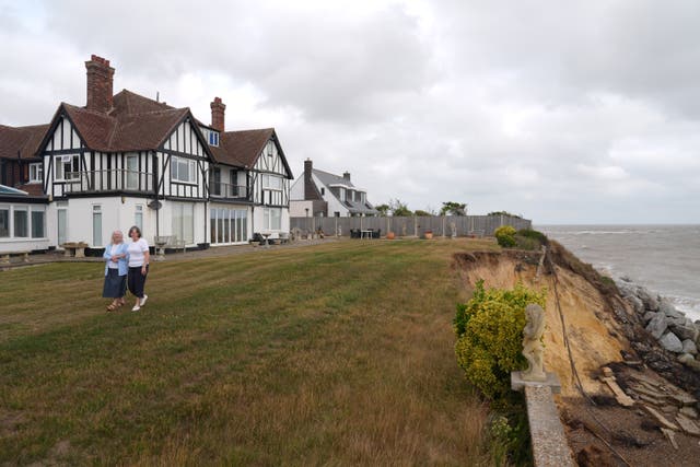 <p>Jean Flick, with her daughter Frances, outside of her home in Suffolk</p>