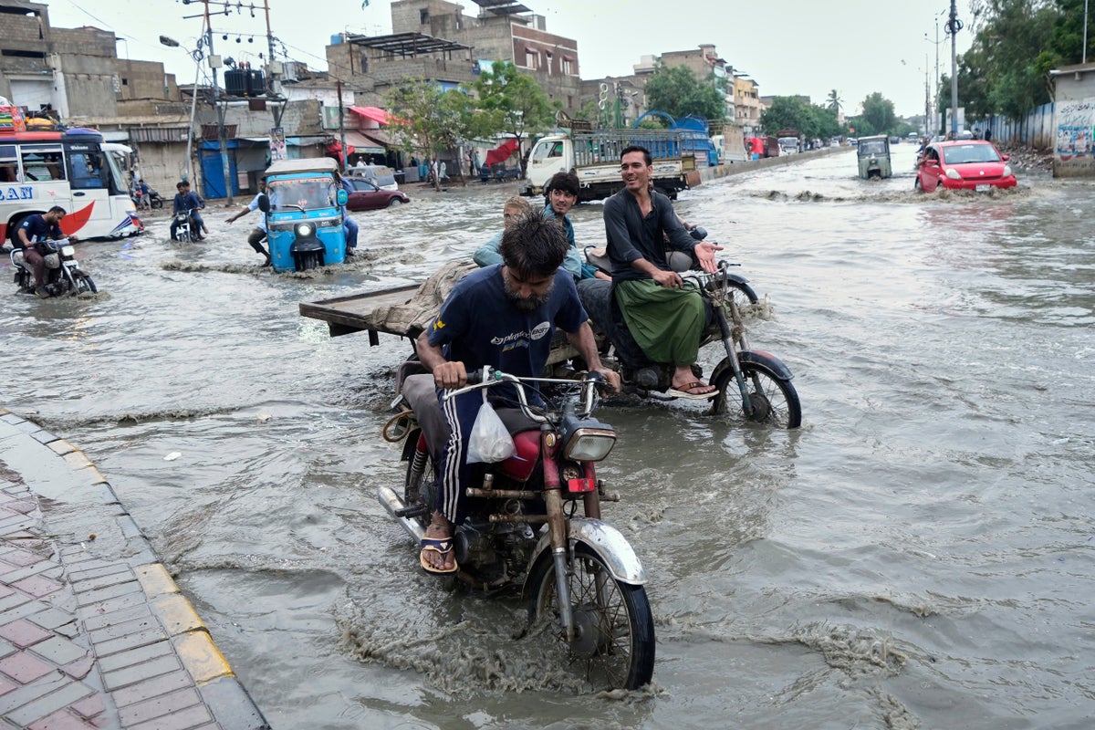 Pakistan restores electricity and reopens roads in areas where floods killed over 300