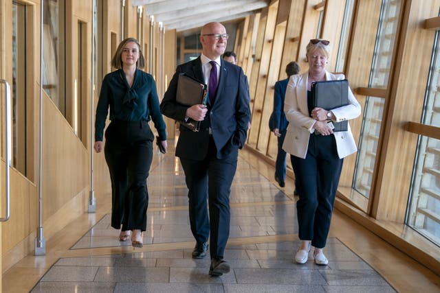Scottish First Minister John Swinney has said he has ‘no intention’ of reshuffling his cabinet, despite a number of senior government figures saying they will stand down at the next election (Jane Barlow/PA)