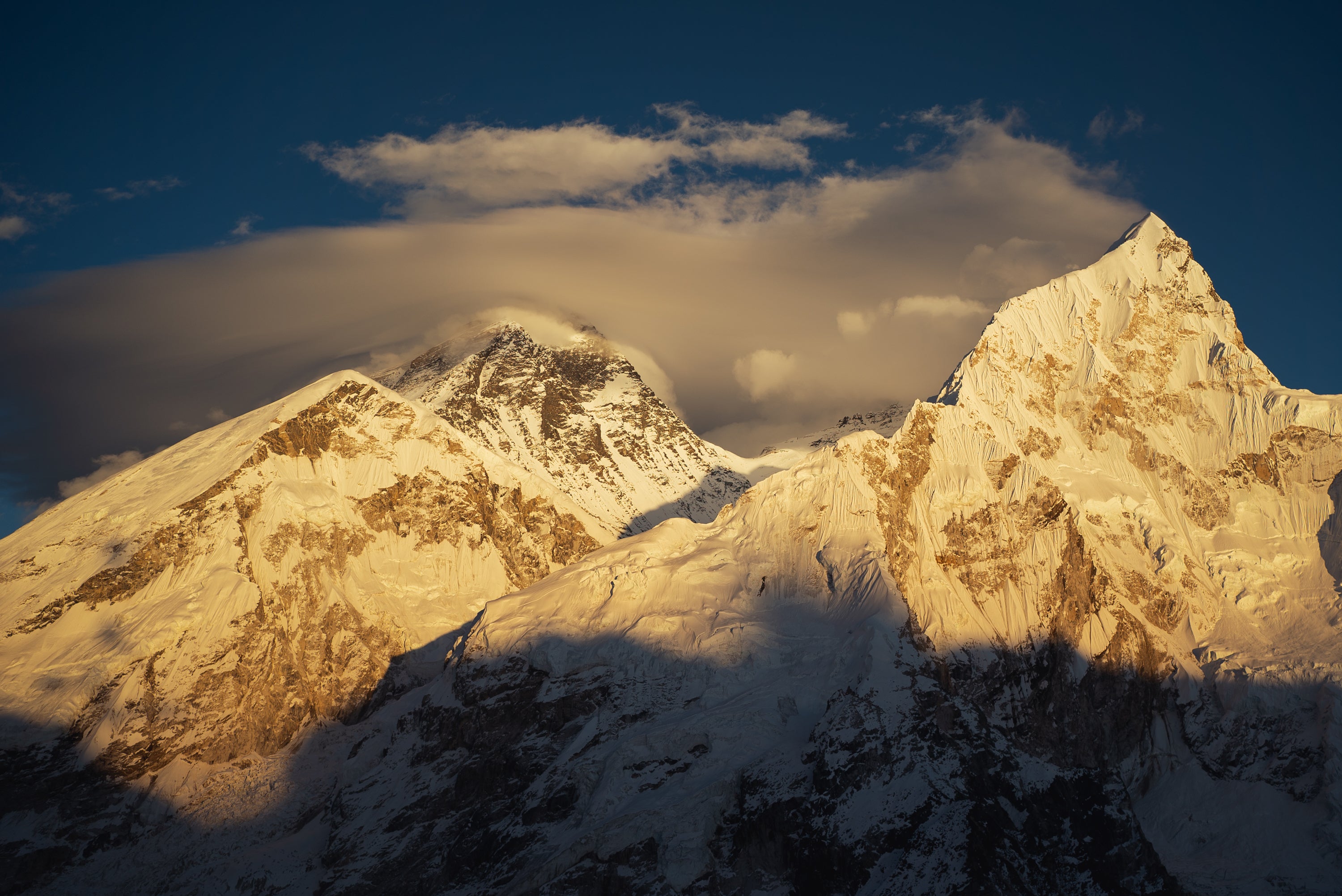 Mount Everest, centre with cloud bank, as seen from Kallapattar viewpoint