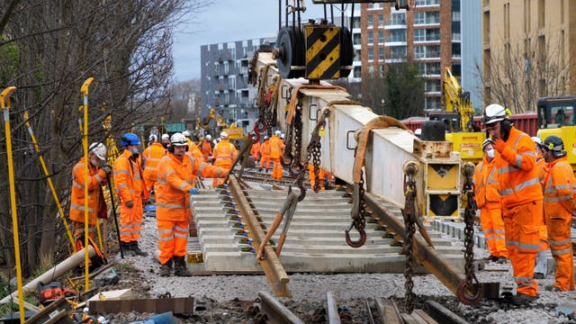 <p>Orange army: Network Rail engineers at work</p>