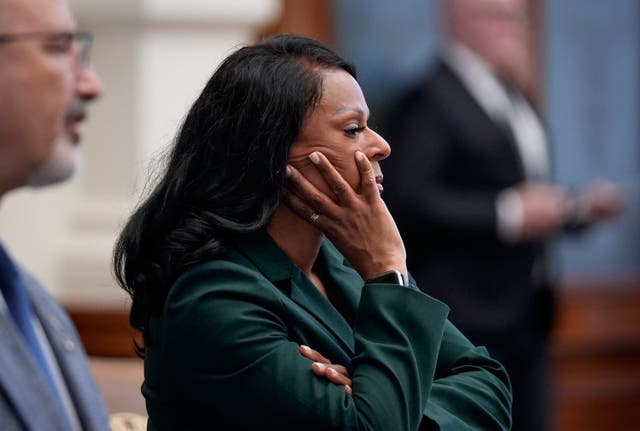 <p>Rep. Nicole Collier listens to House Speaker Dustin Burrows announce the need for permission slips for Democratic state representatives to leave the House chamber in Austin, Texas, on Monday August 18 2025</p>