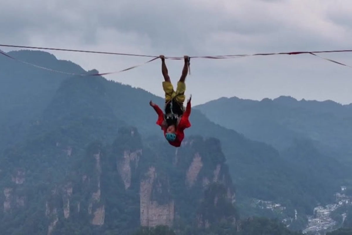 Competitors walk slackline 400m above Chinese gorge in bid for championship glory