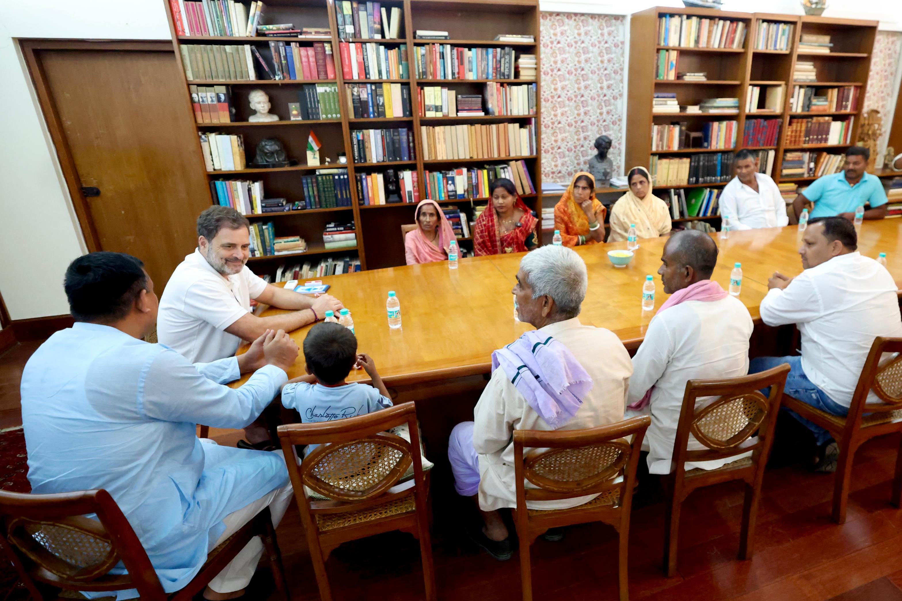 Rahul Gandhi seen sharing tea with Bihar voters, including Ramikbal Ray, declared dead by India’s poll body Election Commission at his sprawling bungalow in New Delhi