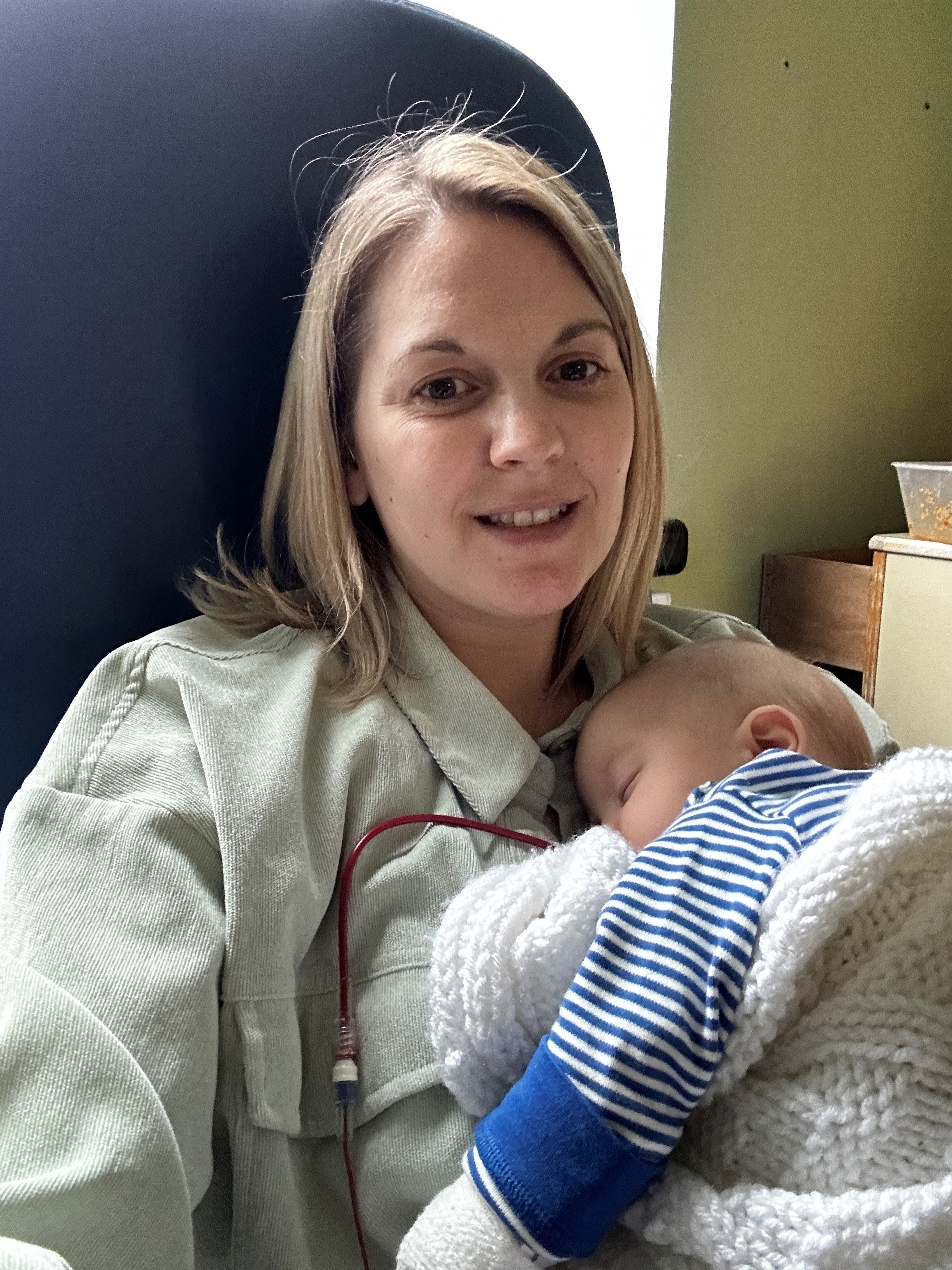Polly Mayers, 35, with her son Woody