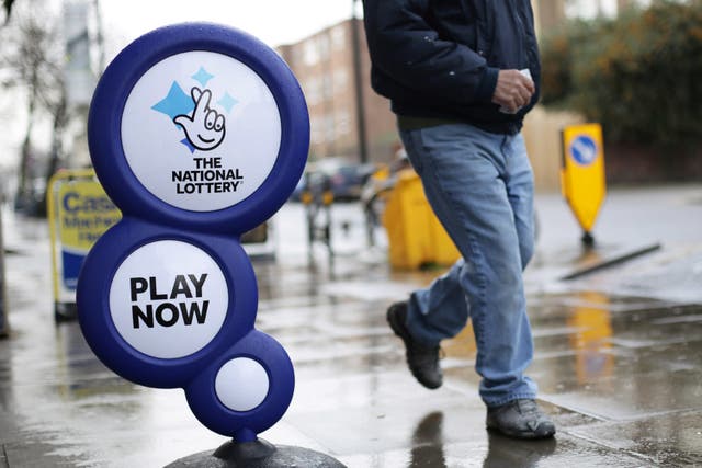 <p>The National Lottery is trying to track down two missing winners  (Yui Mok/PA)</p>