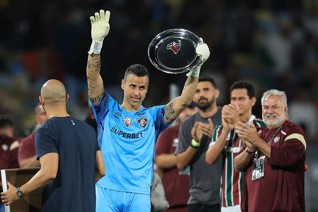 <p>Fabio was awarded a commemorative trophy as Fluminense celebrated his new record </p>