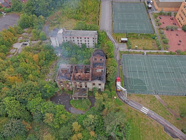 <p>The aftermath of a huge fire at Woolton Hall in Liverpool  </p>