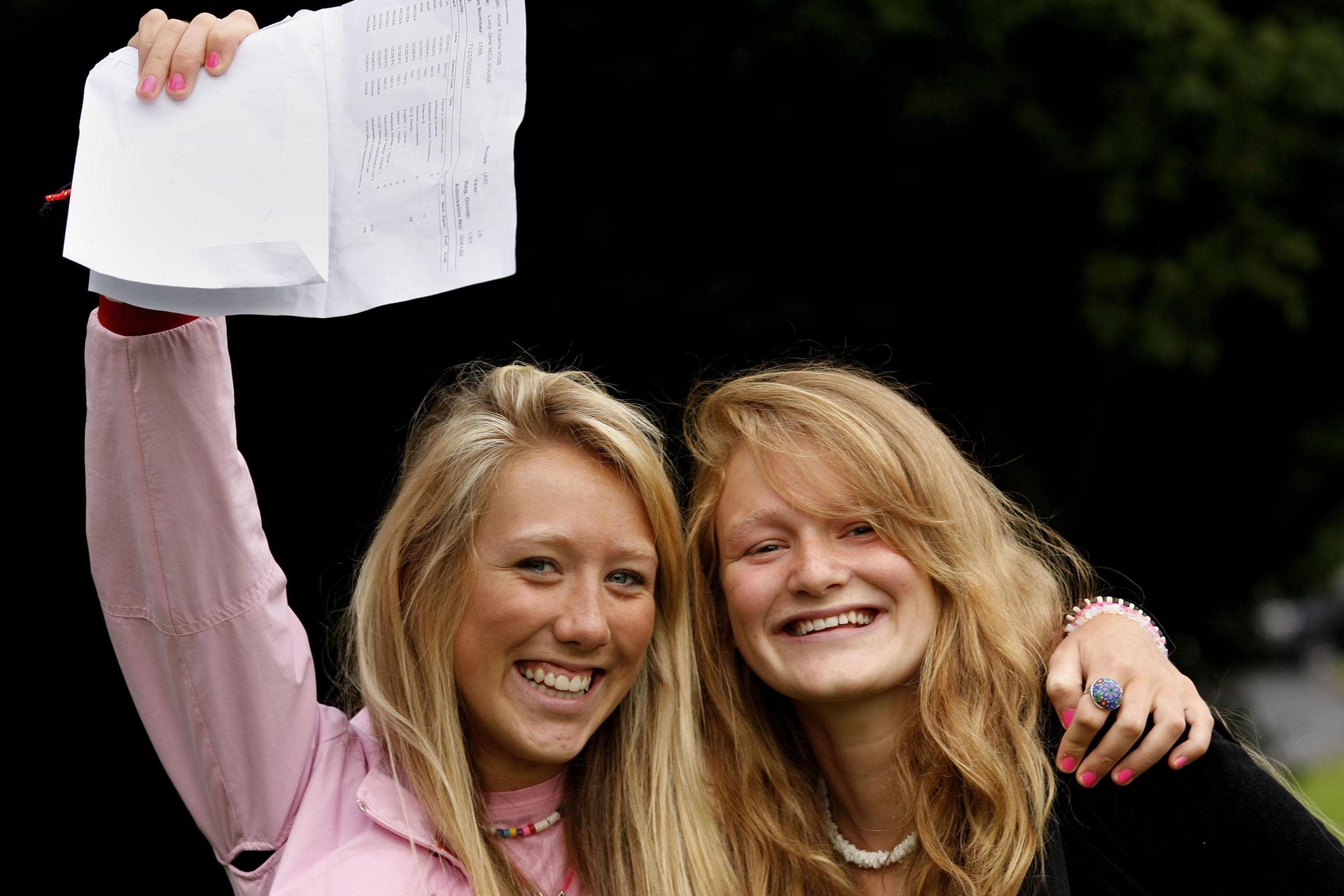 Lucy Mc ILwaine (left) and Jordan McCulla get their GCSE results at Methodist College, Belfast (PA)