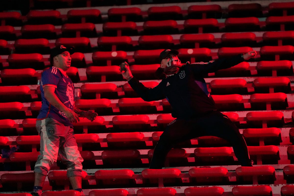 South American football match abandoned after shocking scenes of fan violence
