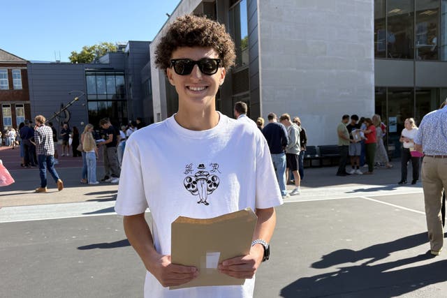 Tuna Lokman receiving his GCSE results at Portsmouth Grammar School (Ben Mitchell/PA)