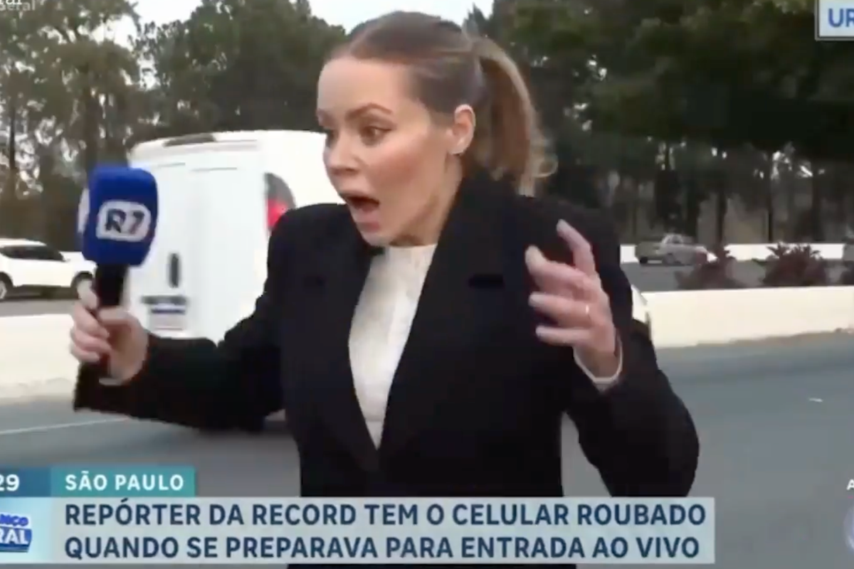 Moment news reporter has her phone snatched out of her hands live on TV