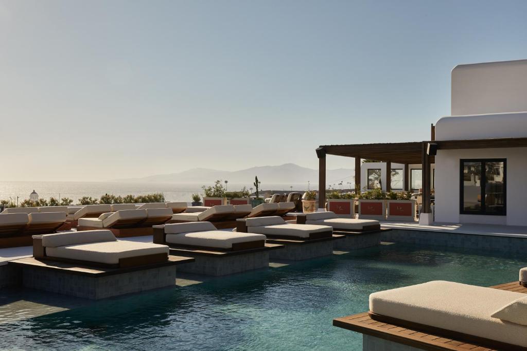 <p>The rooftop area of Anandes, Mykonos hotel features in-pool sun beds</p>