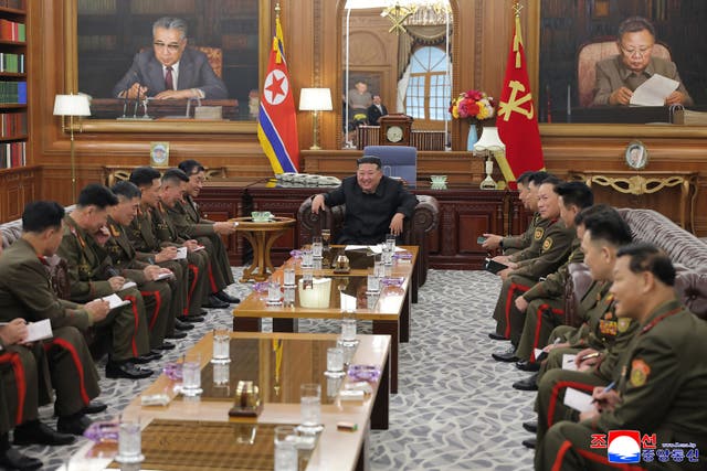 <p>North Korea's leader Kim Jong Un talking with the main commanders of the Korean People's Army</p>