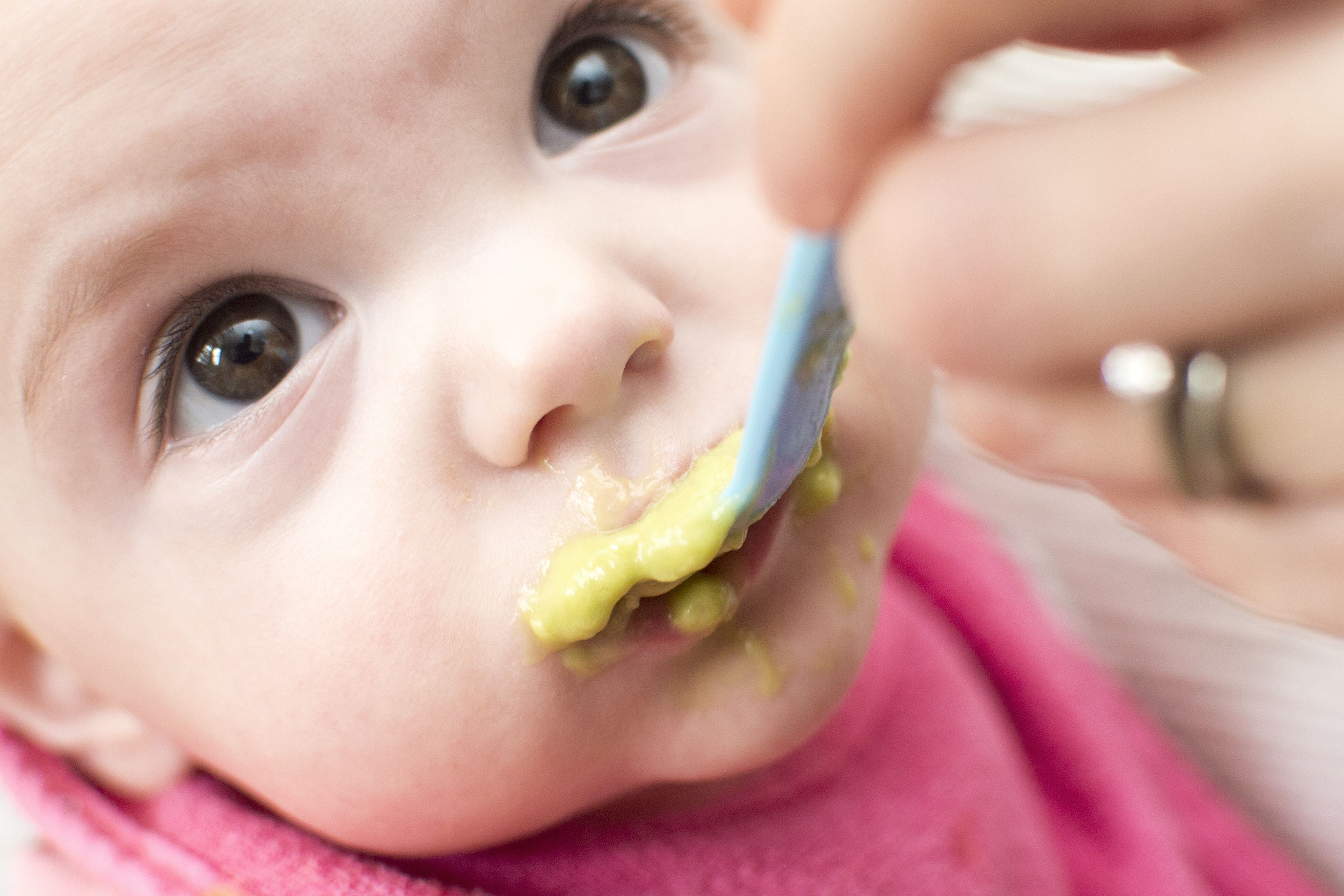 A baby being fed puree (Anthony Devlin/PA)