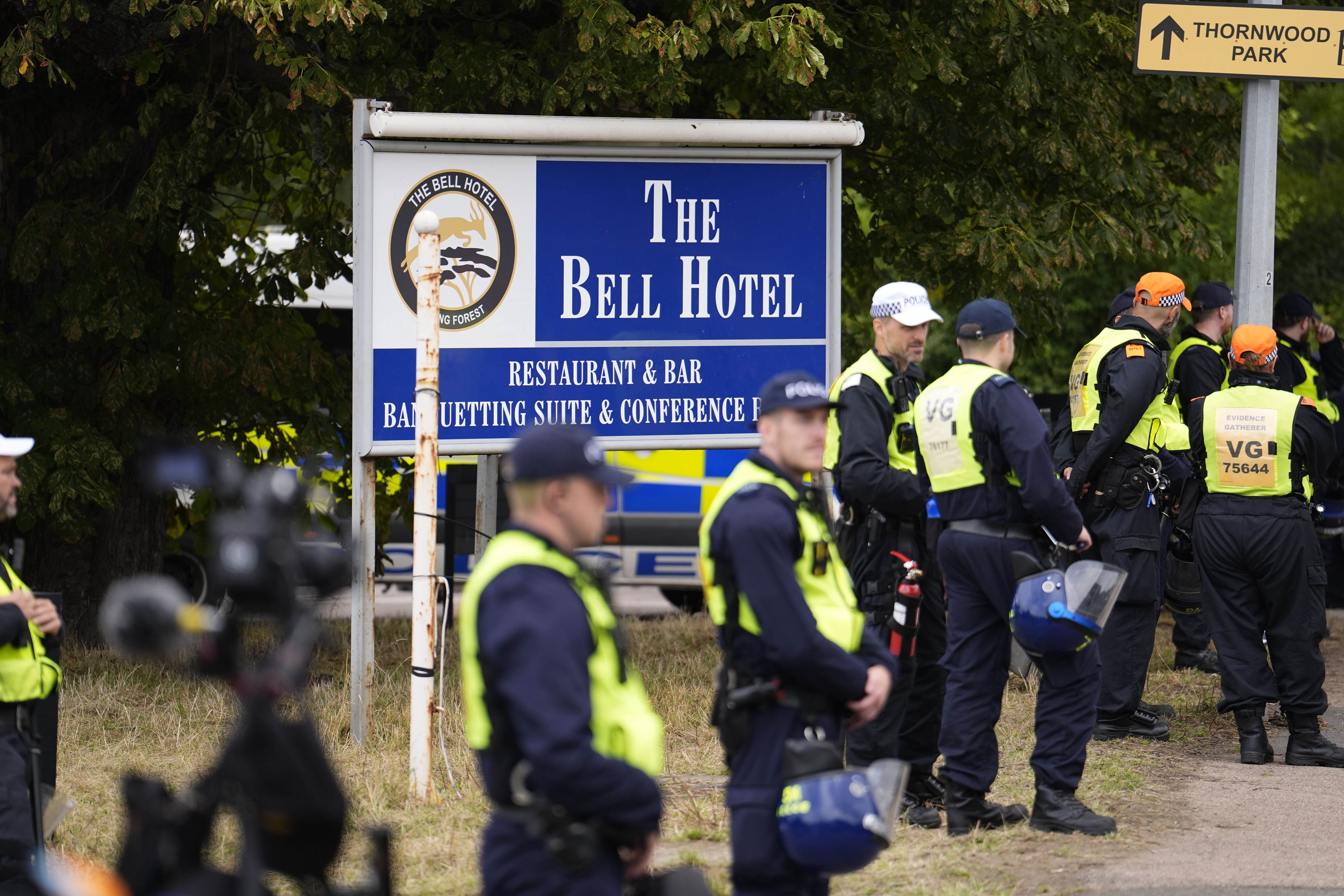 Police officers outside the former Bell Hotel in Epping (PA)