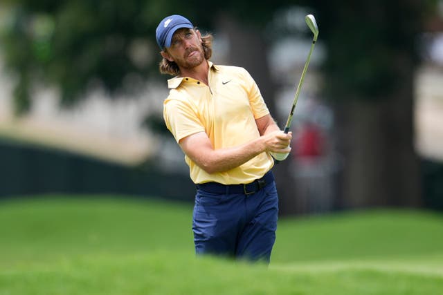 Tommy Fleetwood hits from the first fairway (Mike Stewart/AP)
